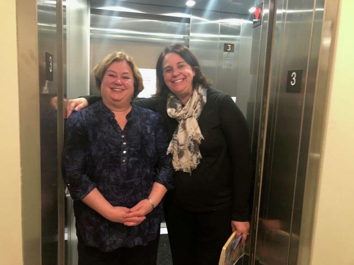 Shelton Library Director Joan Stokes, left, and library Children's Programmer Maura Gualtiere show off the new elevator at Plumb Memorial Library.