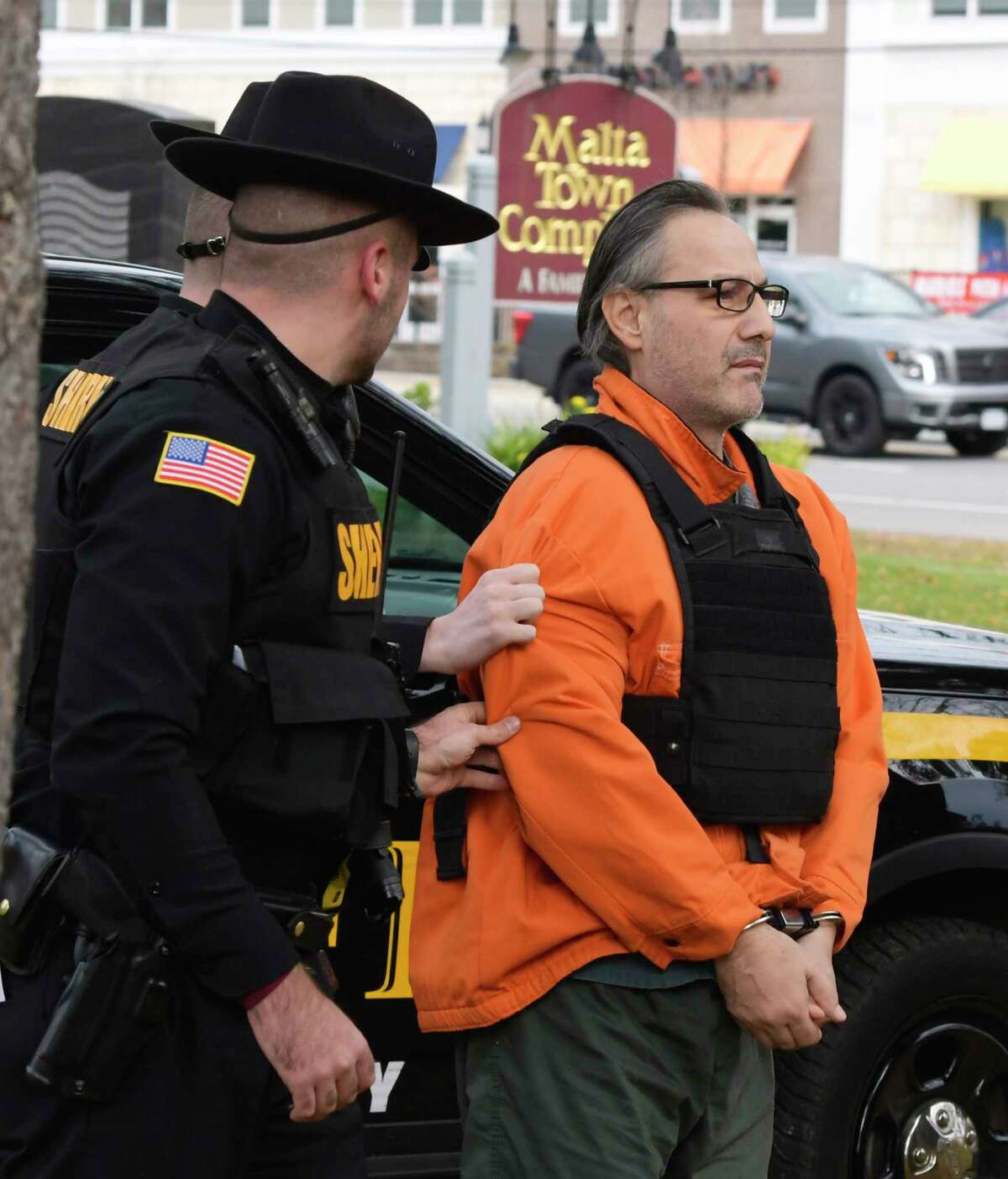 Georgios Kakavelos is brought into Malta Town Court for a court appearance on Tuesday, Nov. 5, 2019, in Malta, N.Y. Kakavelos and a co-defendant have been charged with murder and concealment of a corpse. (Paul Buckowski/Times Union)
