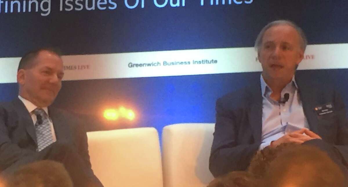 Paul Tudor Jones, left, founder of Stamford-based hedge fund Tudor Investment Corp., and Ray Dalio, founder of Westport-based hedge fund Bridgewater Associates, hold a “fireside chat” on the first day of the Greenwich Economic Forum, on Tuesday, Nov. 5, 2019, at the Delamar hotel in Greenwich, Conn.