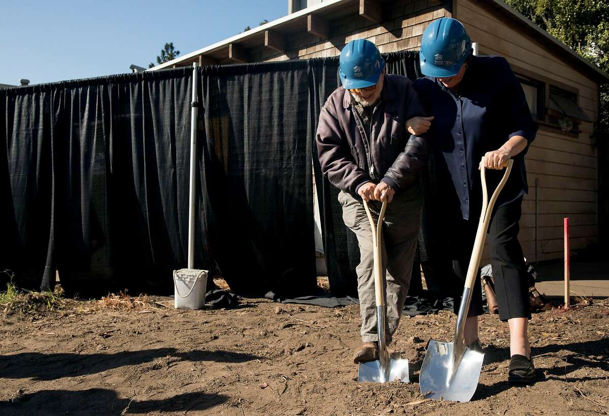 Mische Seligman, 98, (left) and Habitat for Humanity San Francisco CEO Maureen Sedonaen break ground on the site of his childhood home and inherited property on Amber Drive in Diamond Heights during ceremony for the start of construction on new affordable housing by Habitat for Humanity in San Francisco, Calif. Friday, Nov. 1, 2019.