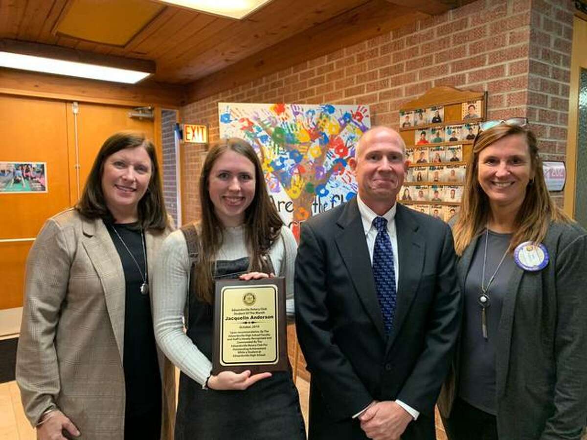 Student of the Month Jacquelin Anderson, second from left, poses with her mother, Catherine, left; father, Michael, second from right; and Edwardsville Rotary Club’s Student of the Month coordinator, Ann Tosovsky.