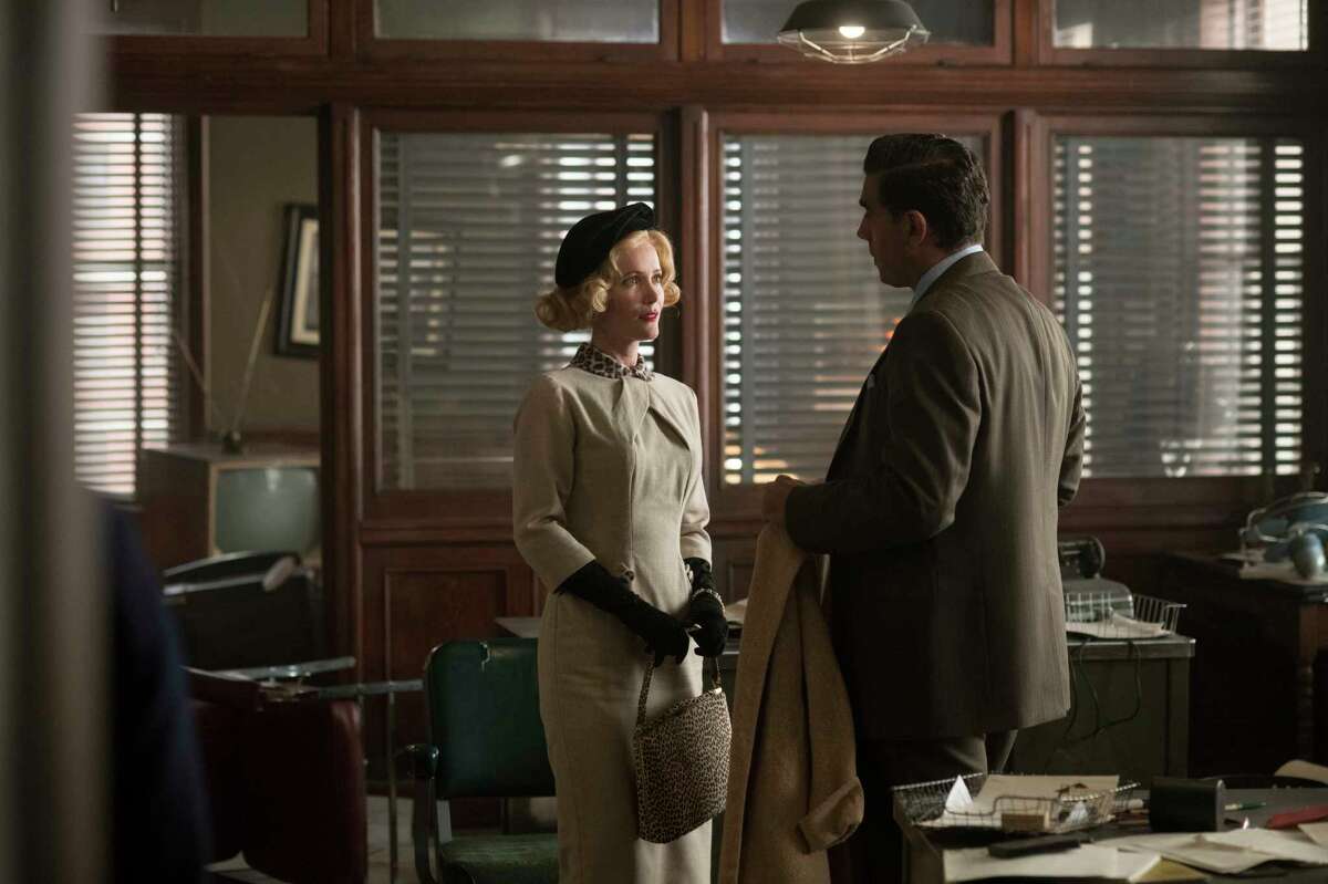 This image released by Warner Bros. shows Leslie Mann, left, and Bobby Cannavale in a scene from "Motherless Brooklyn." (Glen Wilson/Warner Bros. Pictures via AP)