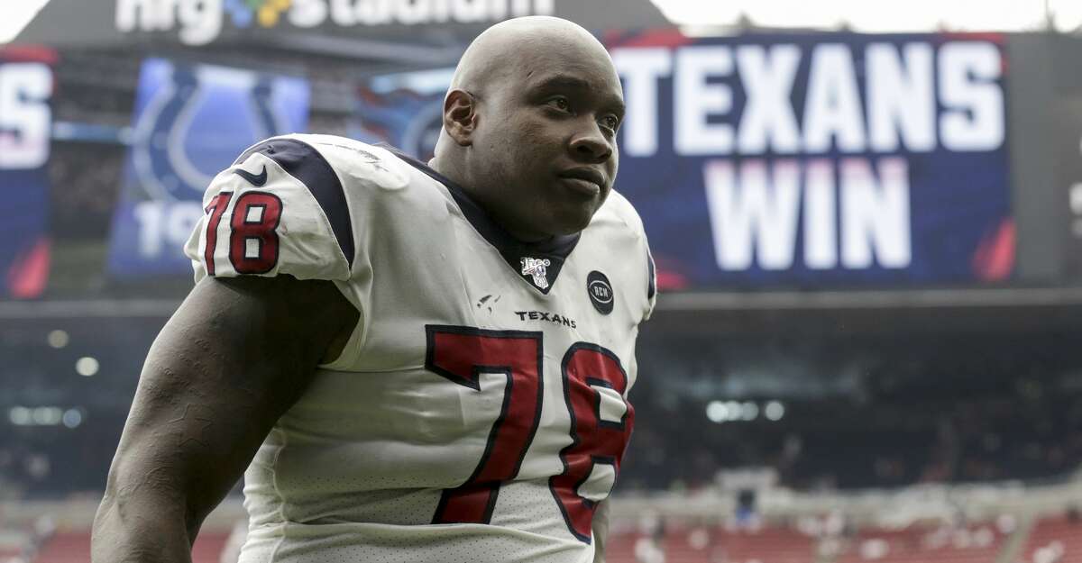 Texans' Laremy Tunsil surveys rainy conditions pre-game vs. Ravens