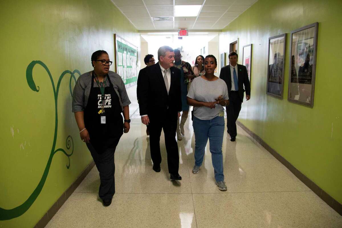 U.S. Census Bureau Director Steven Dillingham talks to Kellie Karavias as Dillingham visits the Gregory-Lincoln Education Center on Tuesday, Nov. 5, 2019, in Houston.