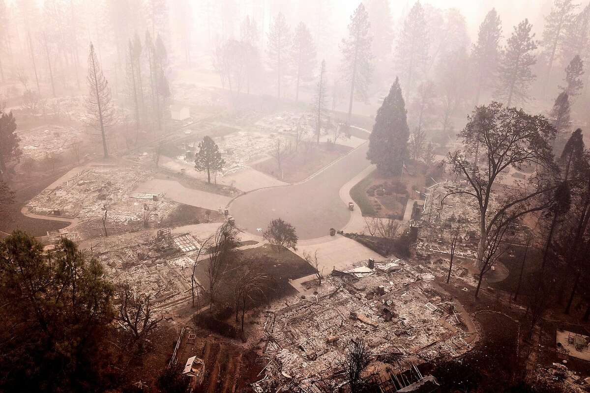 The flattened homes at Mountain Meadow Court at Country Oak Drive, Thursday, Nov. 15, 2018, in Paradise, Calif. As of this morning, the Camp Fire has burned 140,000 acres. The wildfire is 40% contained. 56 people have died.