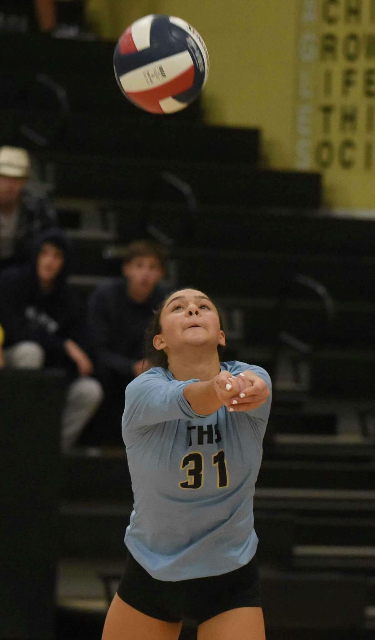 Trumbull libero Ashleigh Johnson (31) keeps the ball up during an FCIAC girls volleyball quarterfinal game against New Canaan at Trumbull High School on Tuesday, Nov. 5, 2019.