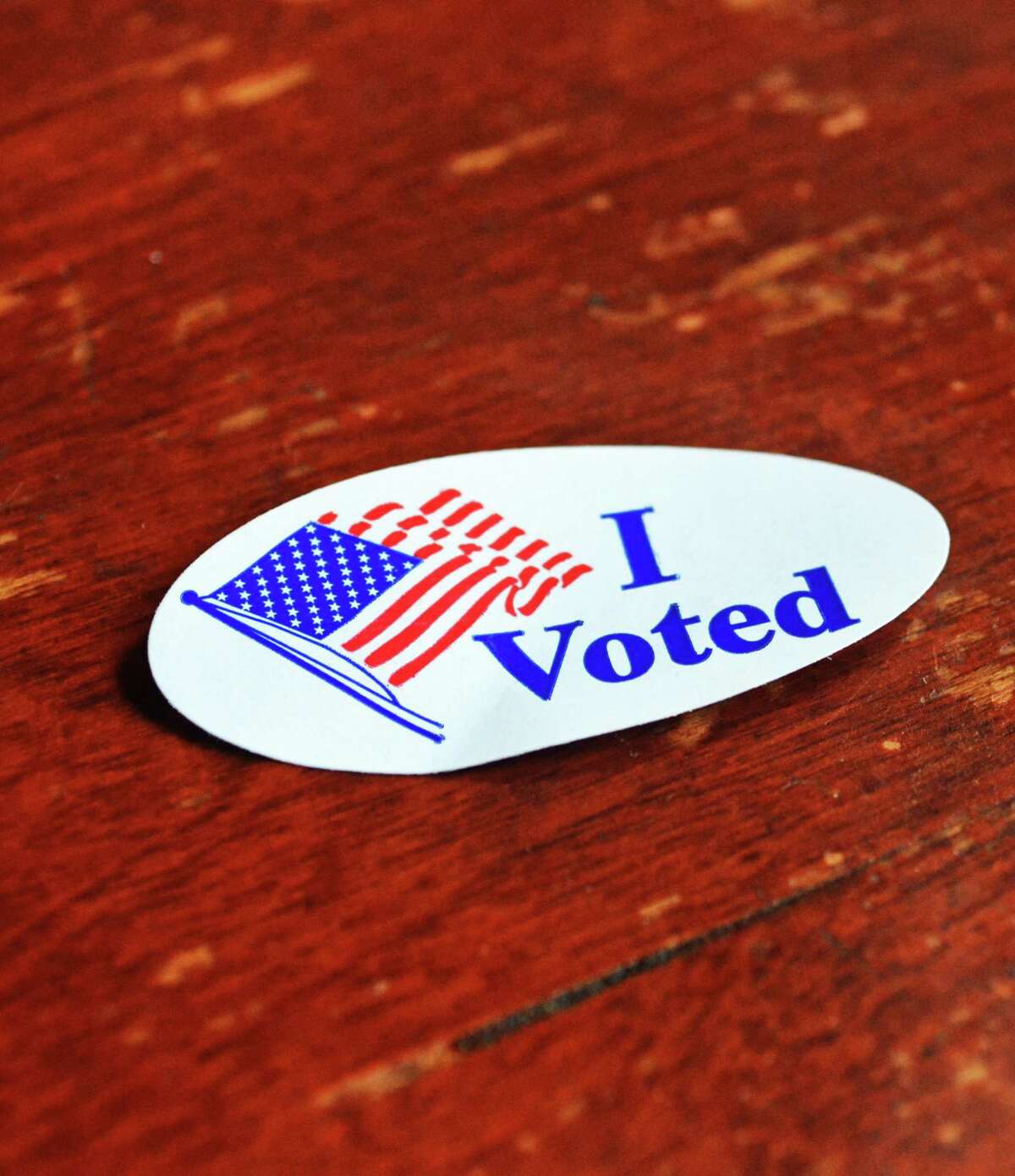 Voters who cast their ballots at the polling stations receive a special sticker.