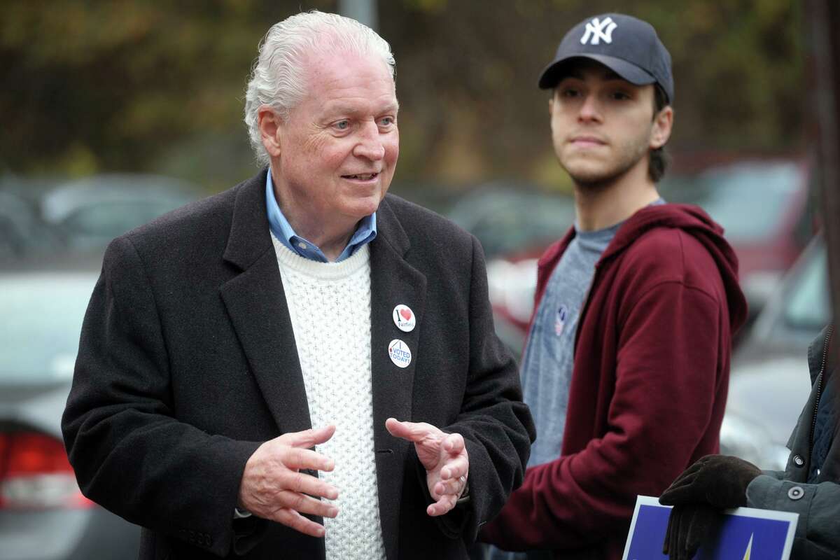 Democratic First Selectman Mike Tetreau greets voters outside Dwight School, in Fairfield, Conn. on Election Day, Nov. 5, 2019.