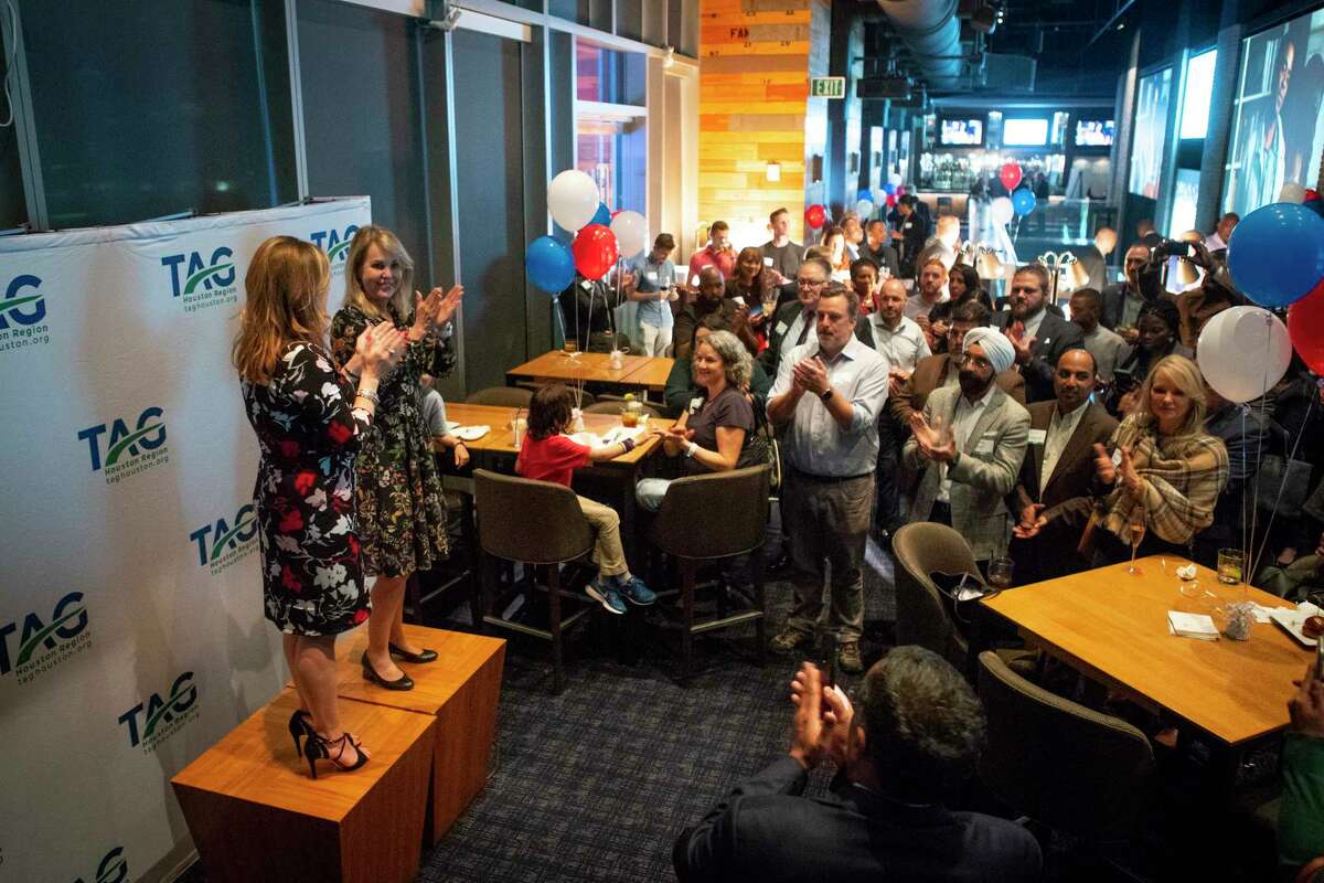 Andrea French (left), executive director of the Transportation Advocacy Group Houston Region, and Carrin Patman (right), chairwoman of the Metropolitan Transit Authority board, applaud as they address supporters of this election's Metro bond measure during a party at Biggio's in downtown Houston, Tuesday, Nov. 5, 2019. The Metro bond measure was showing a strong likelihood of passing after initial early voting results were released early Tuesday evening.