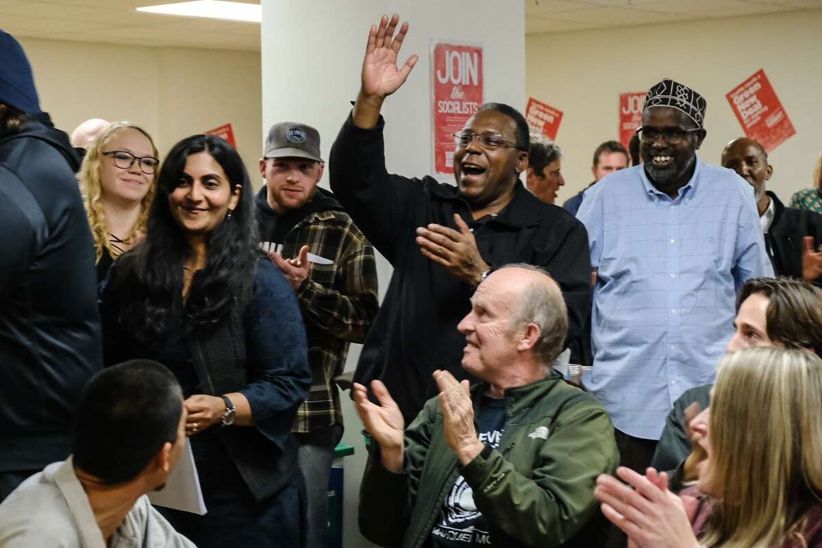 Seattle City Council incumbent Kshama Sawant arrives to a large crowd after the initial numbers drop.