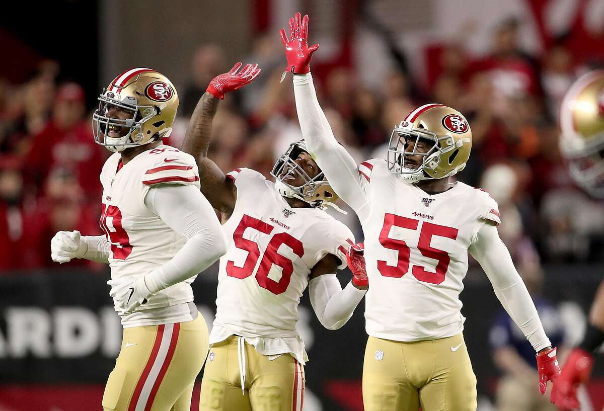 Defensive end Dee Ford #55 , middle linebacker Kwon Alexander #56 and defensive tackle DeForest Buckner #99 of the San Francisco 49ers celebrate a sack during the game against the Arizona Cardinals at State Farm Stadium on October 31, 2019 in Glendale, Arizona. (Photo by Christian Petersen/Getty Images)