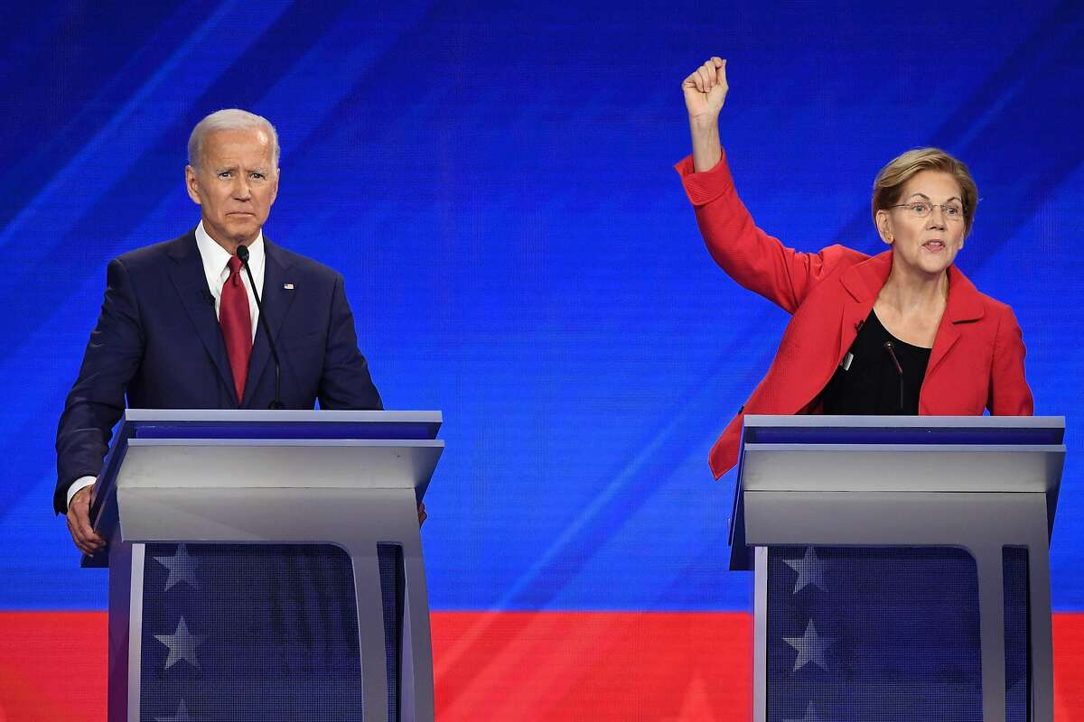 (FILES) In this file photo taken on September 12, 2019 Democratic presidential hopefuls Former Vice President Joe Biden (L) and Massachusetts Senator Elizabeth Warren participate in the third Democratic primary debate of the 2020 presidential campaign season hosted by ABC News in partnership with Univision at Texas Southern University in Houston, Texas. - US Democratic presidential candidate Elizabeth Warren has squeezed ahead of long-time front-runner Joe Biden for the first time, according to compiled polls released October 8, 2019. The RealClearPolitics poll average put Warren on 26.6 percent and Biden on 26.4 percent in the Democratic primary contest to take on President Donald Trump in the 2020 election. (Photo by Robyn BECK / AFP) (Photo by ROBYN BECK/AFP via Getty Images)