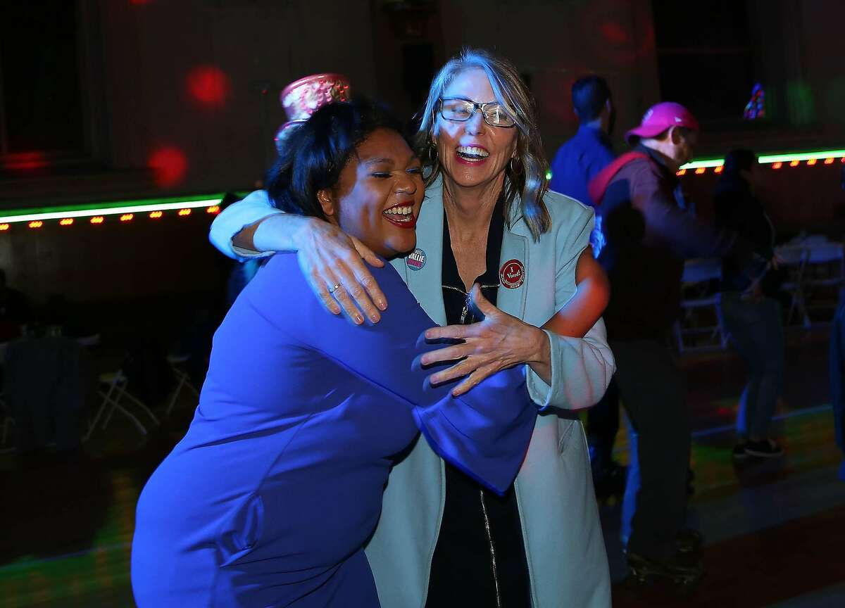 Supervisor Vallie Brown (right) and supporter Cherelle Jackson (left) hug while dancing during Brown’s watch party at Church of Eight Wheels on Tuesday, November 5, 2019 in San Francisco, Calif.