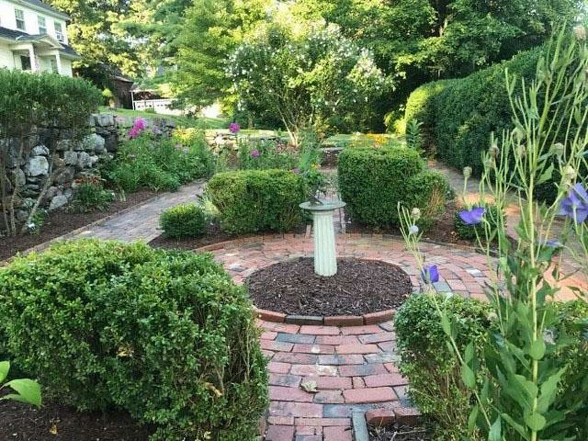 The Garden Club of New Milford has been beautifying town for many years. Members design, plant, water and maintain gardens all over town. October was a busy month. Members tended to six gardens on the Green, gardens at both entrances to town hall, six big concrete containers on the sidewalks on Main Street, two containers on Church Street, the new lighted garden on the north side of the intersection of Route 7 and Bridge Street, where the New Milford sign is located, the garden at the historical society, above, and the garden at NMVNA & Hospice. The club also decorated the bandstand for the recent