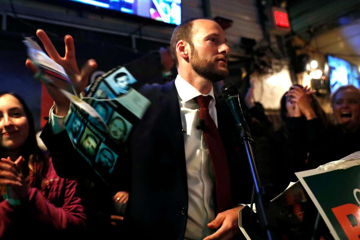 SF District Attorney candidate Chesa Boudin tears up and throws away an attack ad during speech at election night party at SOMA StrEat Food Park in San Francisco, Calif., on Tuesday, November 5, 2019.