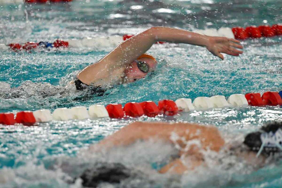 Ridgefield's Rylie Giles competes in the 200-yard freestyle at the FCIAC girls swimming championship meet Tuesday in Greenwich. Giles finished first in the event and also won the 500 freestyle.