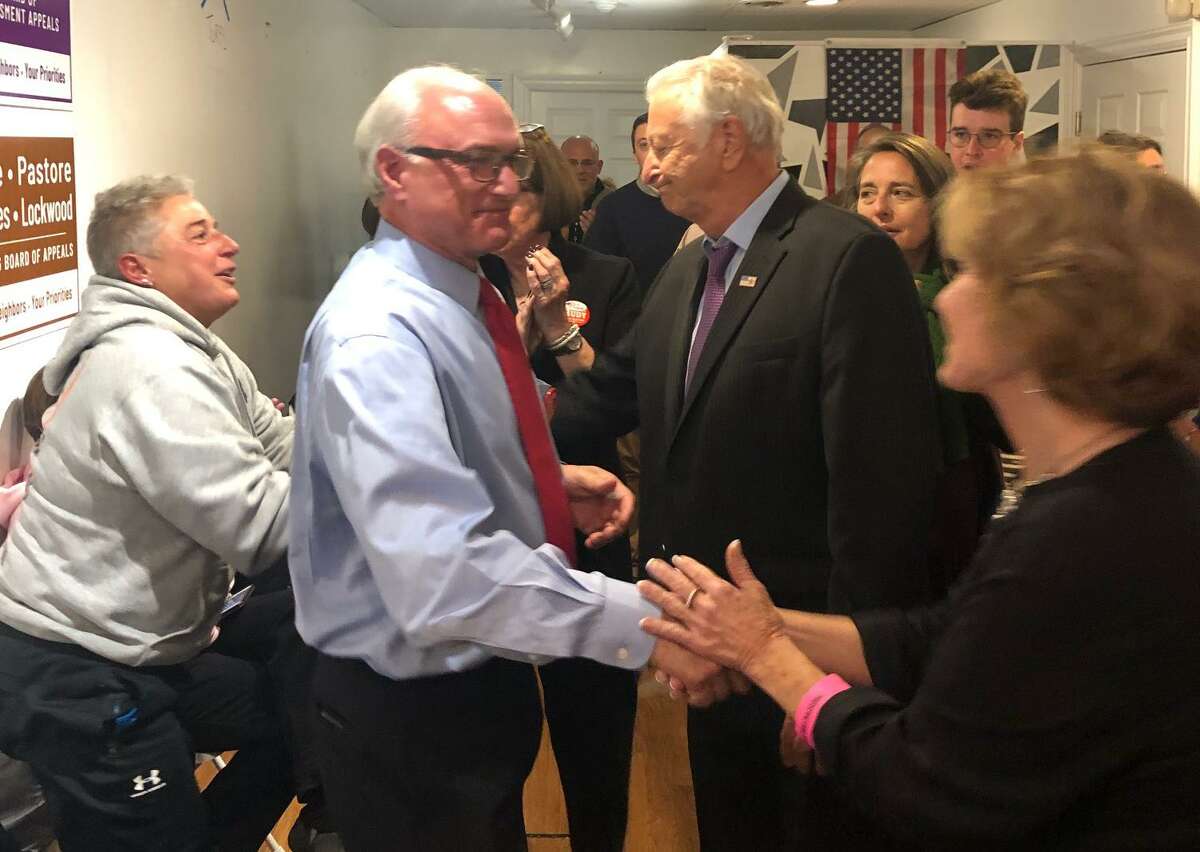 Ridgefield First Selectman Rudy Marconi, left, shakes hands with Republican challenger Dick Moccia and Ridgefield Republican Town Committee Chair Hope Wise on Tuesday, Nov. 5. Marconi won reelection, 5,099 votes to 2,592.