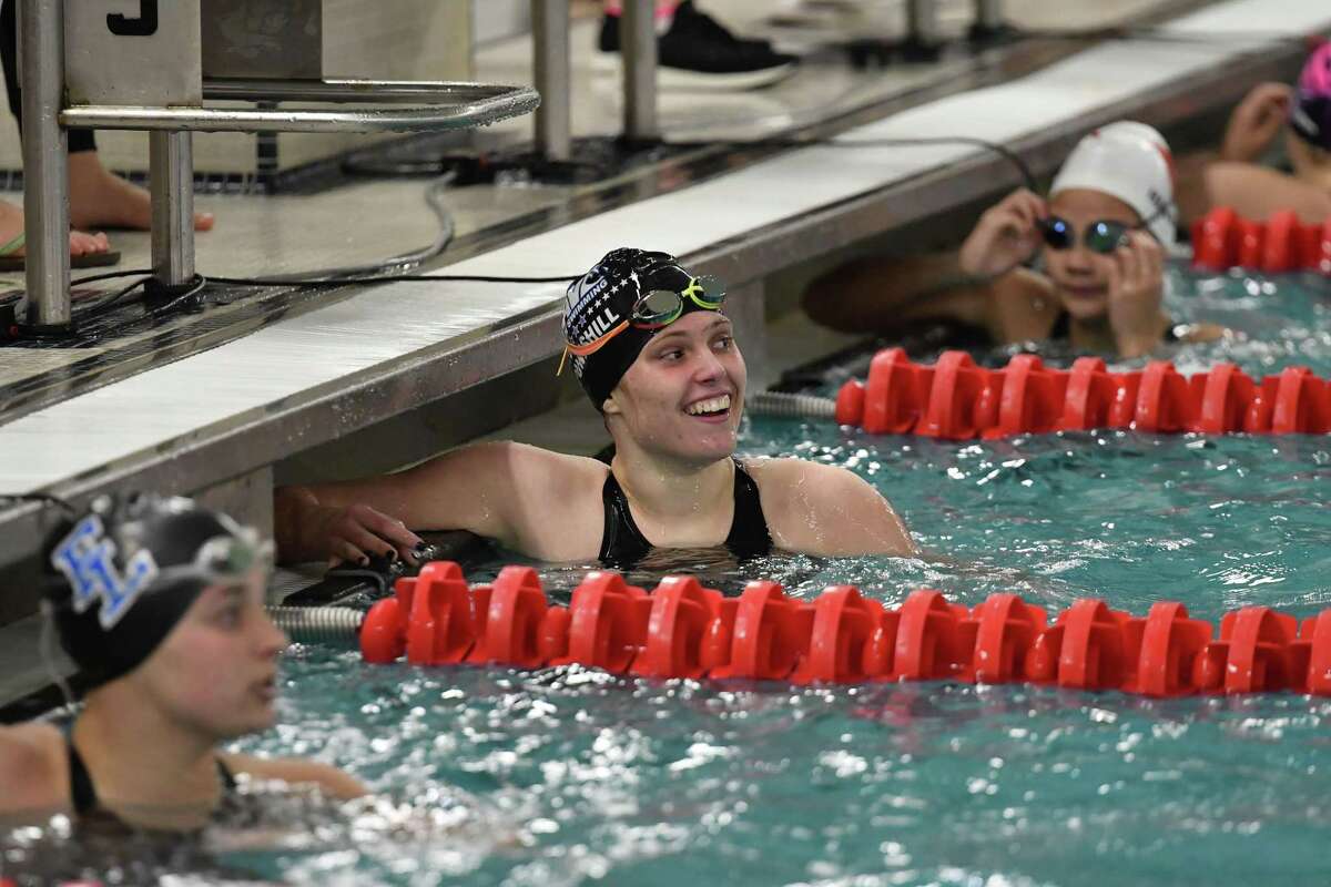Lexi Punishill of the Darien Blue wave reacts after winning the 100yd Freestyle during the FCIAC Girls Swimming Championship on Tuesday9 at Greenwich High School.