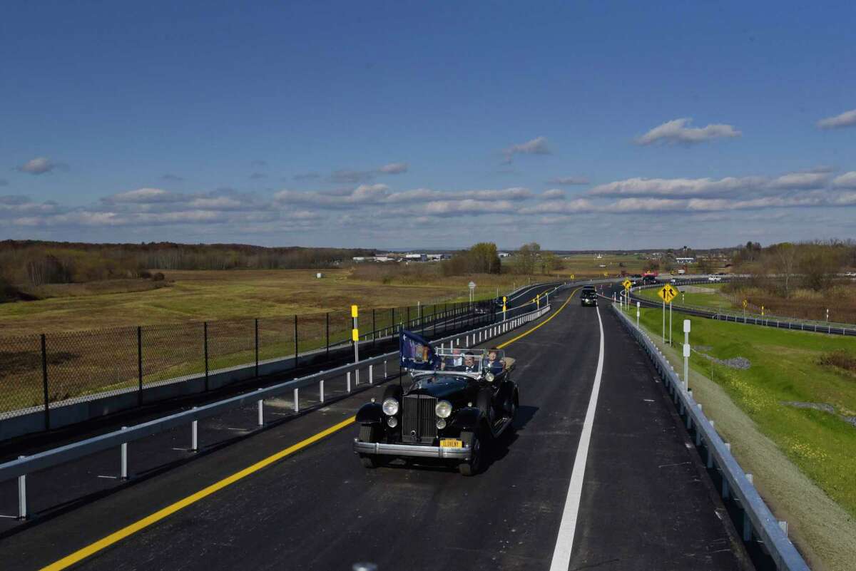 Governor Andrew Cuomo drives FDR's Packard with Marie Therese Dominguez, Commissioner of DOT, Albany County Executive Dan McCoy, and Albany Mayor Kathy Sheehan, over the finished flyover for the new exit 3 off of Interstate 87, on Wednesday, Nov. 6, 2019, in Colonie, N.Y. (Paul Buckowski/Times Union)