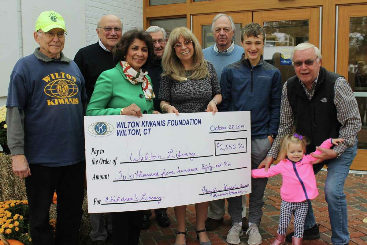 Mary Anne Mendola Franco, fifth from left, is retiring from Wilton Library. She is shown here with library Executive Director Elaine Tai-Lauria and members of the Wilton Kiwanis Club.