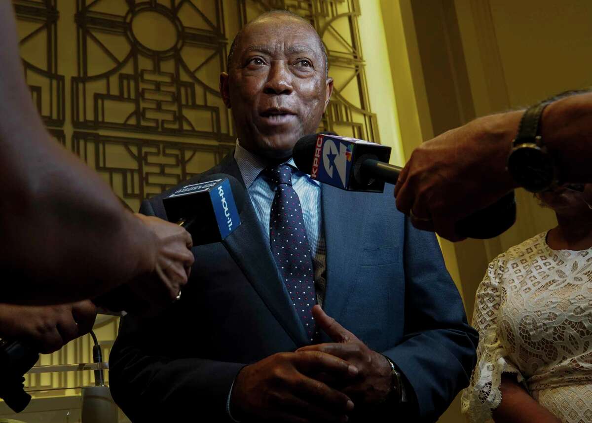 Mayor Sylvester Turner speaks to reporters after a press conference in which he announced a proposed consent decree to improve the city's sanitary sewer system Tuesday, July 9, 2019, in Houston.