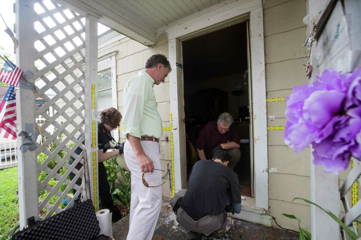 Out of state forensic team brought by the family of the killed homeowners at a botched drug raid work the bullet holes still at the home on 7815 Harding on Friday, May 10, 2019, in Houston. The home was the scene of a botched drug raid that took place on Jan. 28, 2019 and left the two homeowners dead and five police officers injured.