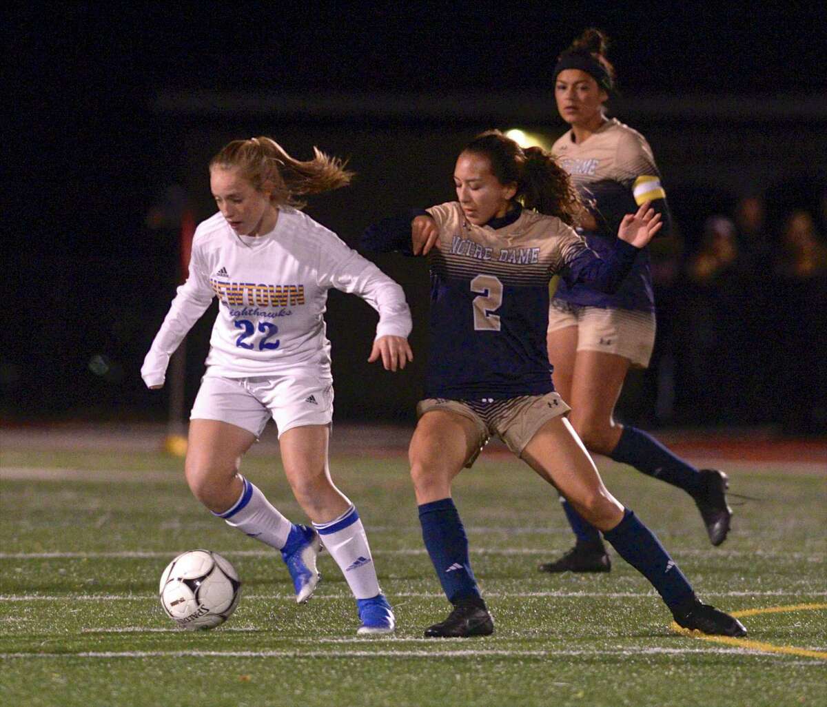 Newtown's Katie Rowan (22) and Notre Dame-Fairfield's Mackenzie Ledford (2) turn on the ball in the SWC girls soccer final between No.2 Notre Dame-Fairfield and No. 5 Newtown. Wednesday, November 6, 2019, at Joel Barlow High School, Redding, Conn.
