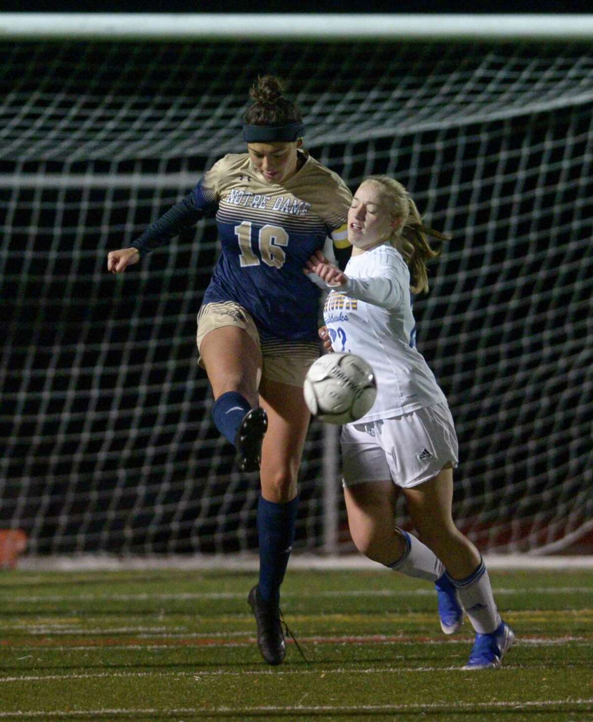 Notre Dame-Fairfield’s Jazmine Fred (16) and Newtown’s Katie Rowan fight for the ball in the SWC girls soccer final on Wednesday in Redding.