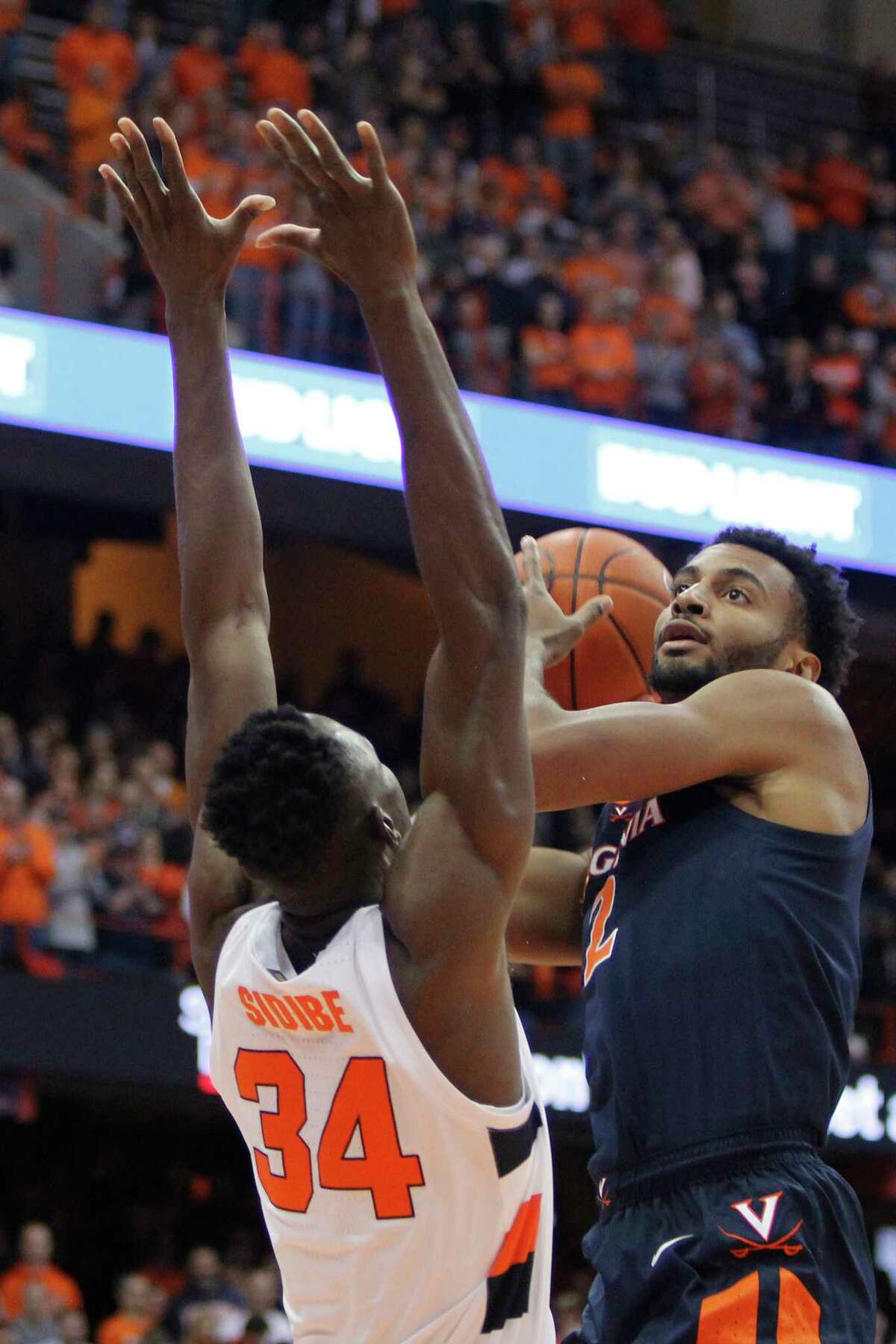 Virginia's Braxton Key, right, shoots over Syracuse's Bourama Sidibe, left, during the first half of an NCAA college basketball game in Syracuse, N.Y., Wednesday, Nov. 6, 2019. (AP Photo/Nick Lisi)