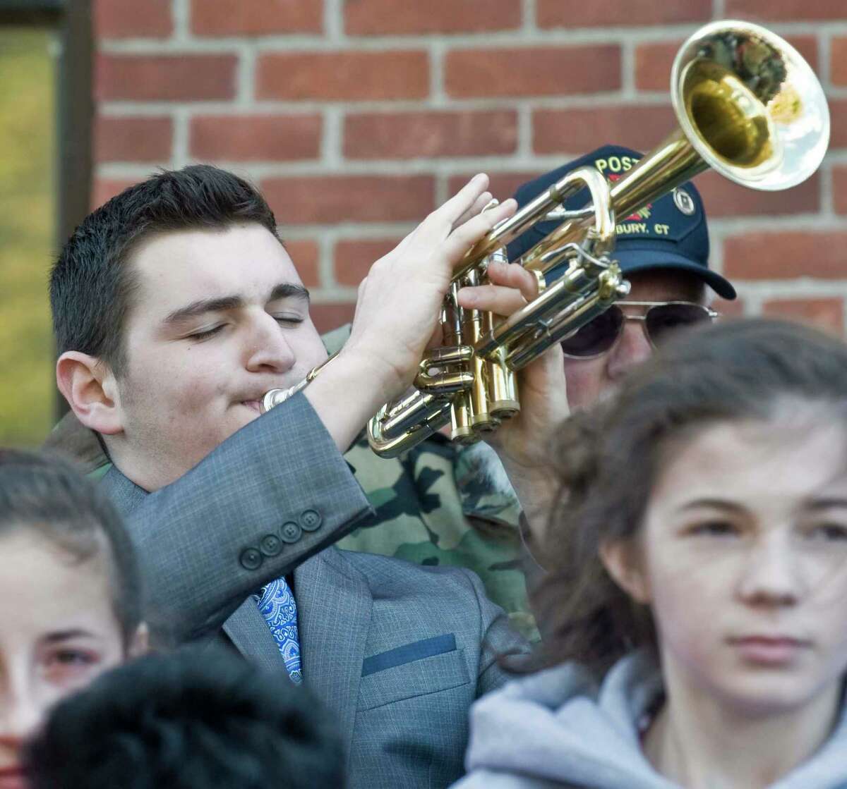 Maxwell Durkin of Danbury plays Taps during the Veteran's Day Ceremony in front of the War Memorial Building at Rogers Park in Danbury. Friday, Nov. 11, 2016