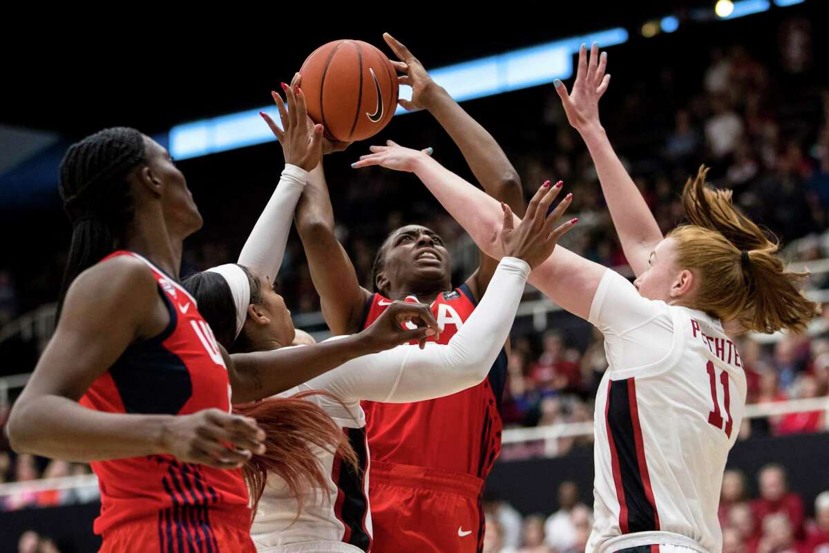 USA forward Nneka Ogwumike (16) shoots as Stanford forward Ashten Prechtel, right, and Stanford guard Kiana Williams, left, defend in the second quarter of an exhibition women's basketball game, Saturday, Nov. 2, 2019, in Stanford, Calif. (AP Photo/John Hefti)