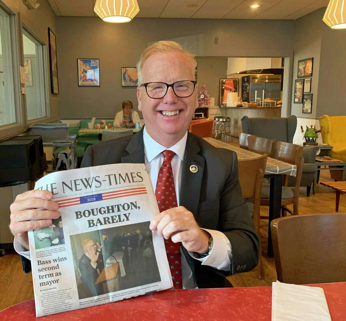 Mayor Mark Boughton shows the local newspaper the day after winning an unprecedented 10th term.