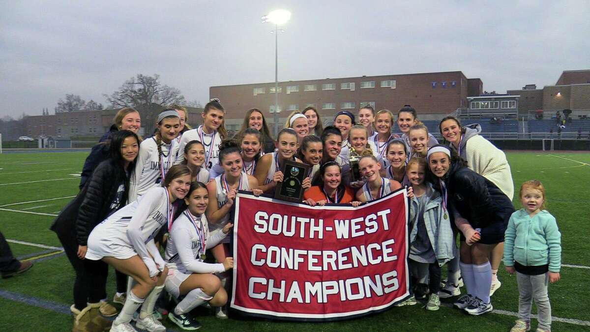 The Immaculate field hockey team celebreates winning the SWC field hockey championship after beating New Milford 1-0 in the championship game on Thursday, Nov. 7, 2019 at Brookfield High School in Brookfield,Conn.