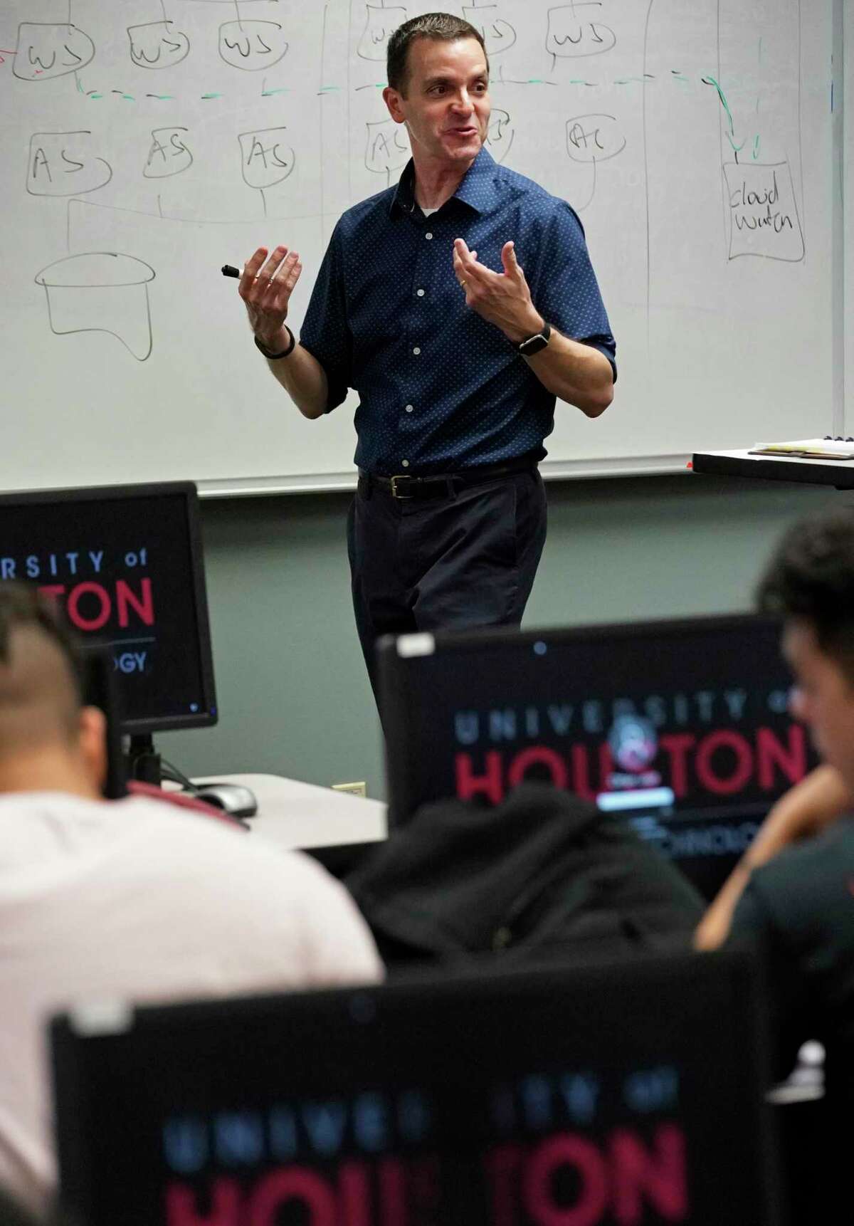 José C. Martínez, an instructional assistant professor of computer information systems, is shown during his class on cloud computing at University of Houston Tuesday, Oct. 29, 2019, in Houston.