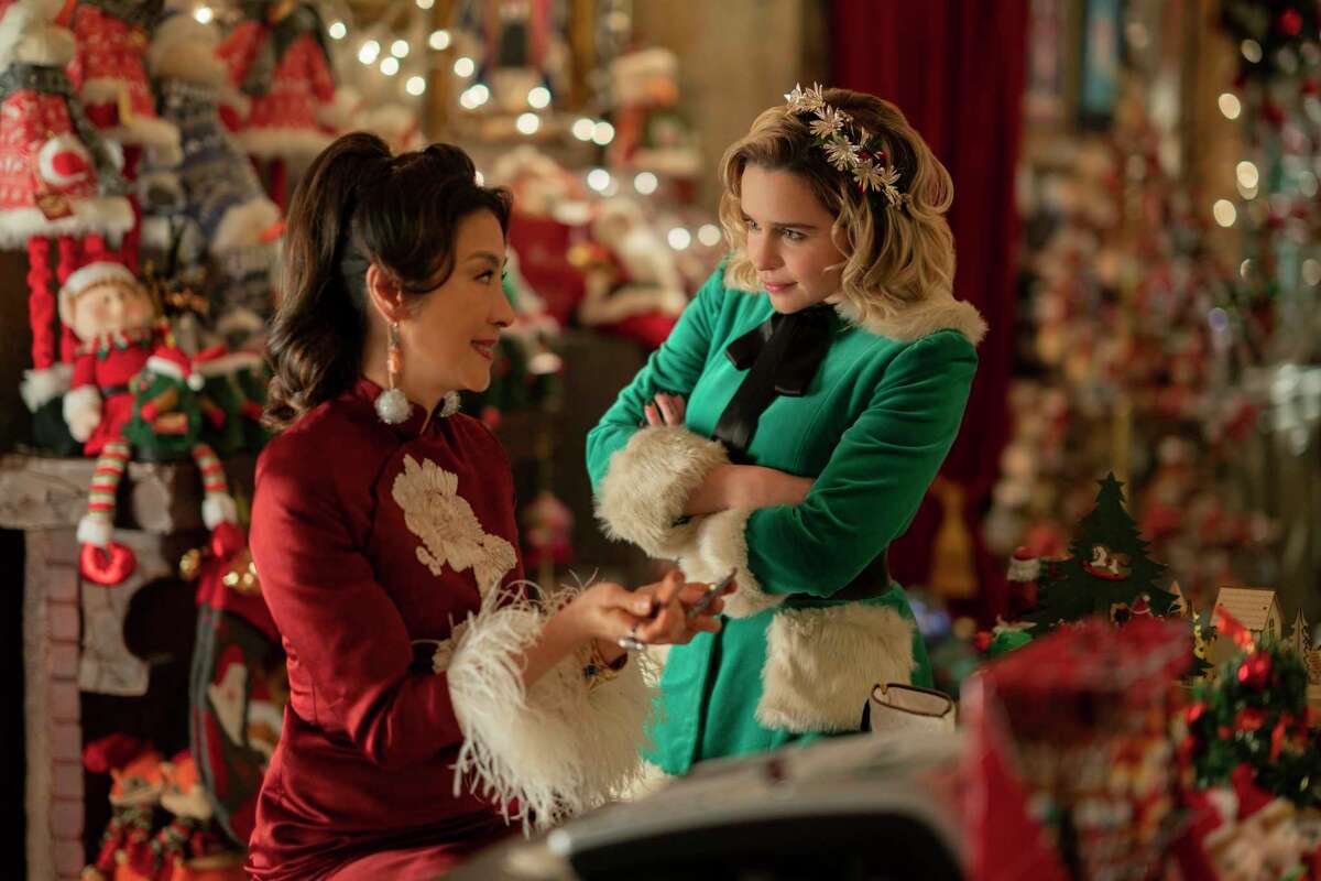 This image released by Universal Pictures shows Michelle Yeoh, left, and Emilia Clarke in a scene from "Last Christmas." (Jonathan Prime/Universal Pictures via AP)
