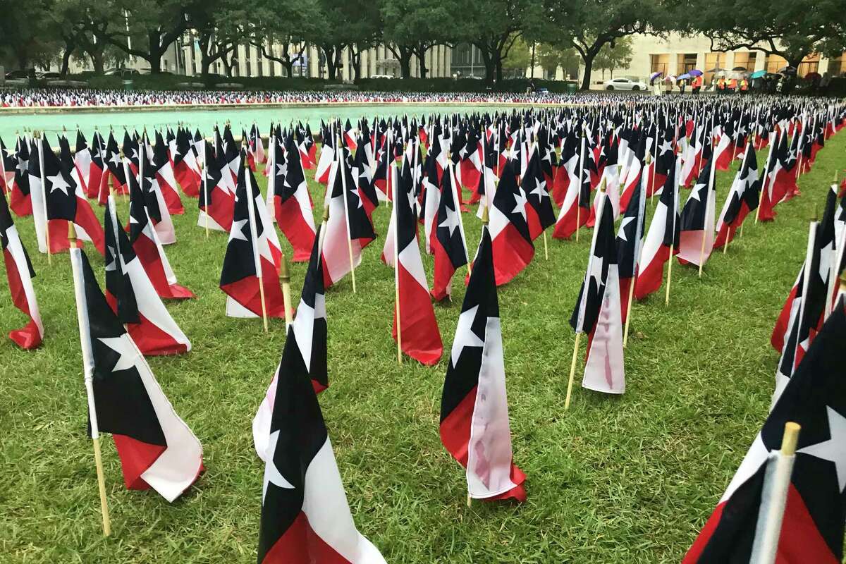 Outside Houston City Hall, transportation officials staked 3,647 Texas flags, one for each of the people killed on state roadways in 2018, for an event Nov. 7, 2019, marking the 19th anniversary of the last day without a road fatality in Texas.