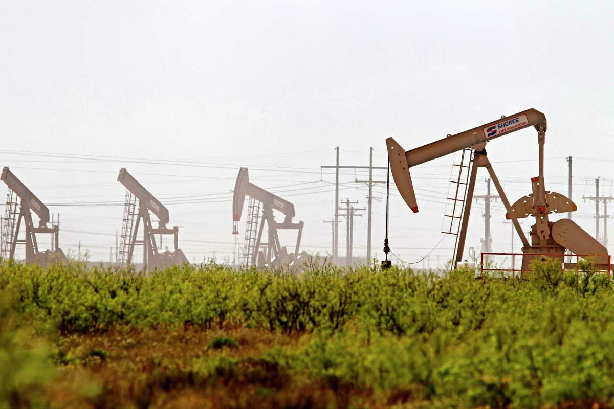 Pumpjacks operate near a Diamondback oil and gas operation, April 17, 2019, in Midland County, Texas. James Durbin / Reporter-Telegram