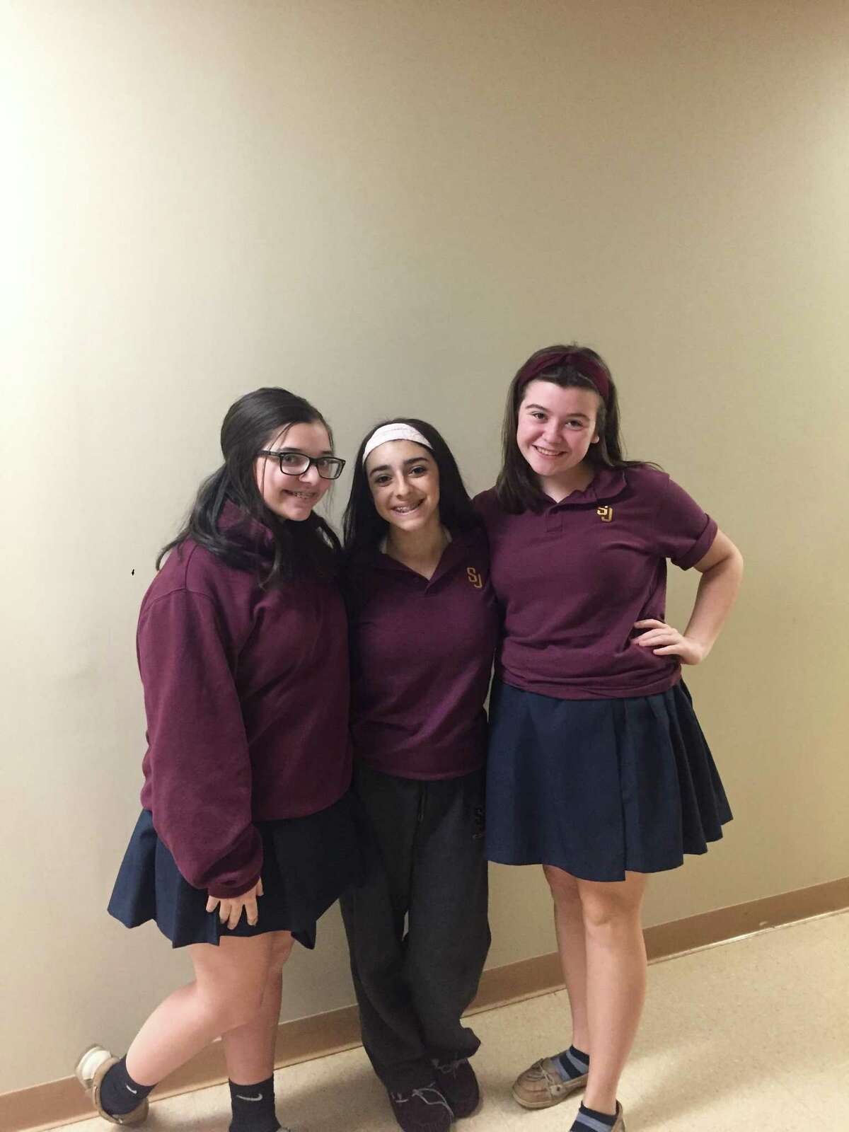 Shelton residents, left to right, Hailey McKeon (Bernardo, Messenger, Player Queen), Morgan DeAngelo (Gravedigger, Fortinbras’ Captain, Gentlewoman), and Kelly McSheery (Guildenstern) are featured in the St. Joseph High School Drama Club’s production of Shakespeare’s Hamlet.