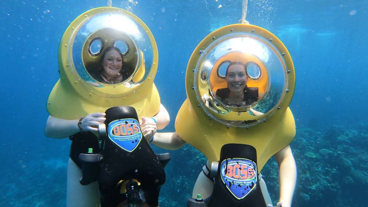 Jess Kelly and a friend using BOSS underwater scooters during a cruise excursion. (Photo by Jess Kelly)