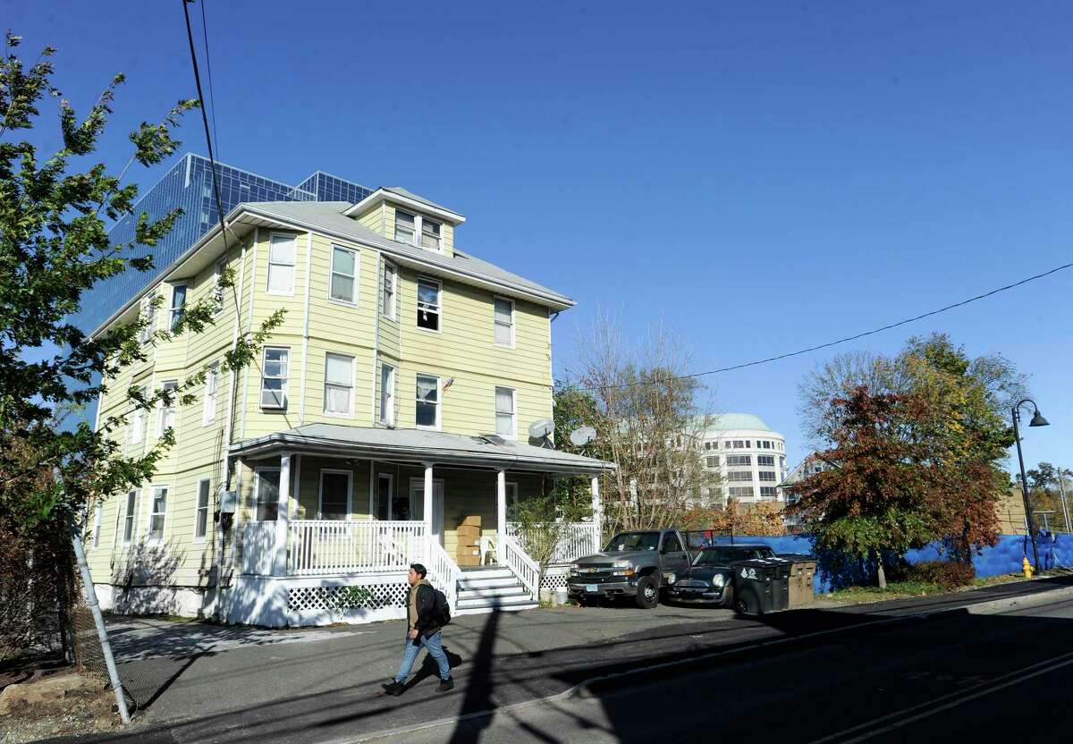 A three-story house at 21 Pulaski Street, photograph on Nov. 1, 2019, is a property that the city of Stamford is proposing to acquire, either through negotiations with the owner or through eminent domain as part of projects to ease transportation woes in the area. Pulaski Street connects Waterside and the South End, a corridor that the the city's Transportation, Traffic and Parking Department is hoping to widen.