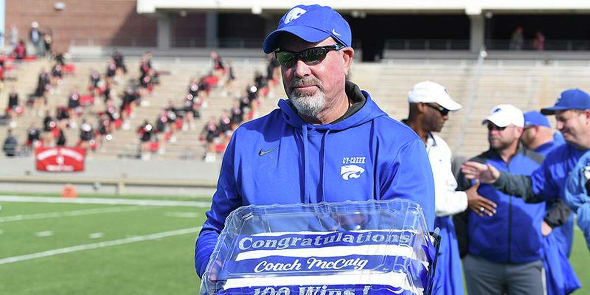 Cy Creek head football coach Greg McCaig was presented with a celebratory cake by Cy Creek faculty after winning his 100th career game.