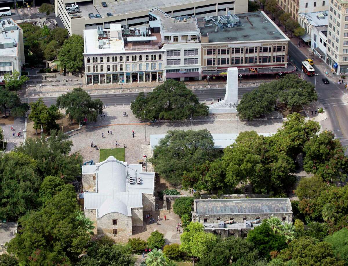 Alamo Plaza, with the Alamo at the bottom left corner, is seen in a Thursday Oct. 8, 2015 aerial photo. The while marble cenotaph can be sent the right of the image in front of three building the Texas General Land Office recently agreed to buy.