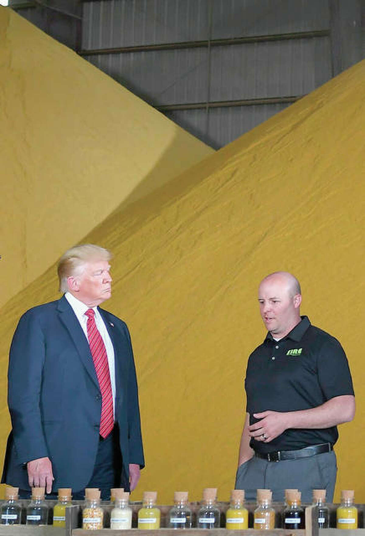 President Donald Trump looks at corn samples used for biofuel production.