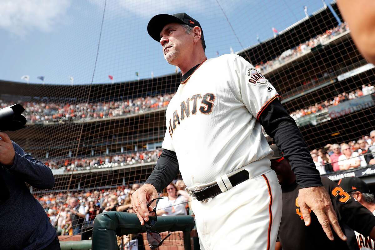 San Francisco Giants' Bruce Bochy walks out for National Anthem before his final game as Giants' manager at Oracle Park in San Francisco, Calif., on Sunday, September 29, 2019.