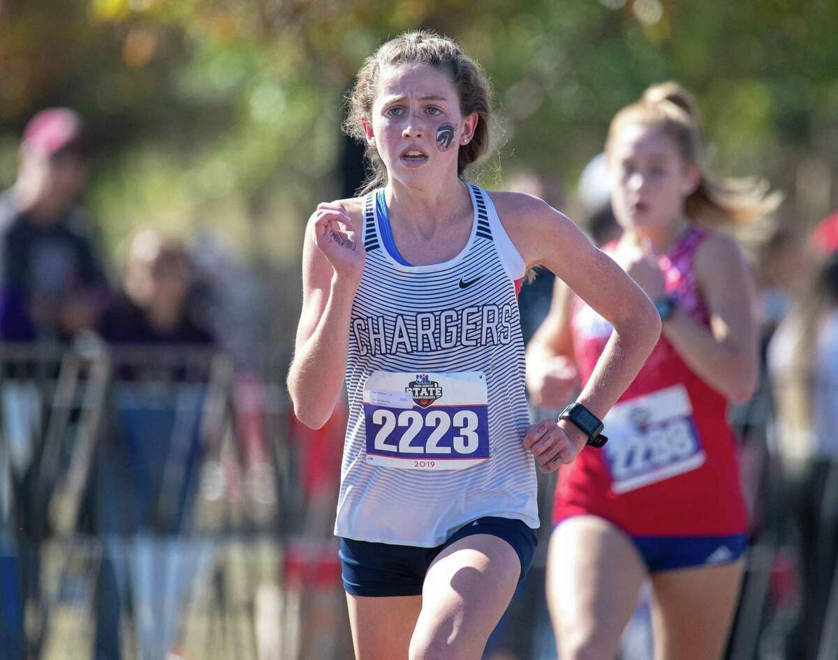 Round Rock, TX; Boerne Champion Kate Williams approaches the finish line for the Girls 5A 5K run at the UIL State Cross Country meet on Saturday, Nov 9, 2019, at Old Settlers Park. [John Gutierrez / for SA Express-News]