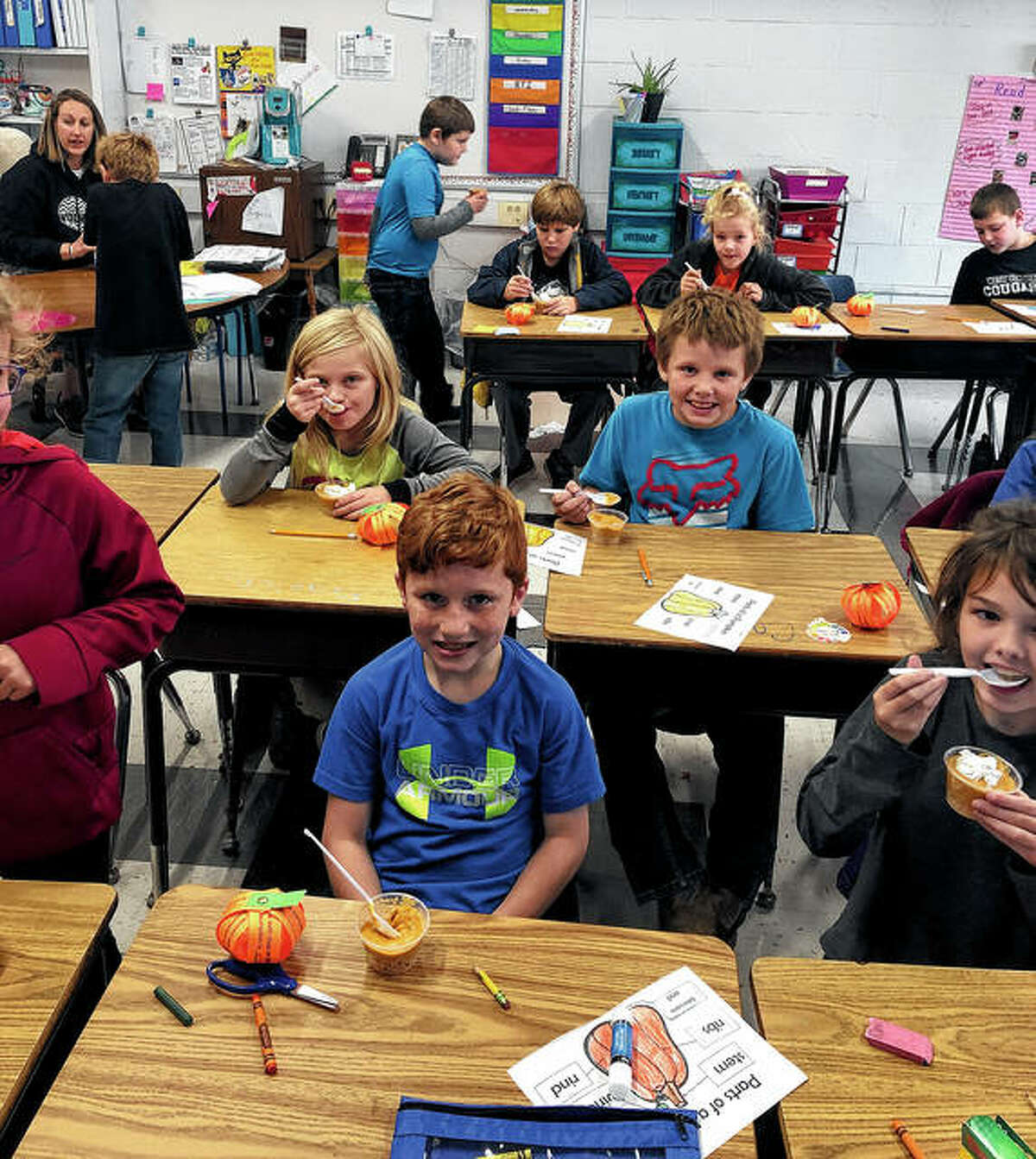 Winchester Elementary School third-graders in Mrs. Leonard’s class — Carter Stice (from left), Daxton Littig and Ainsley Freeman — work on a pumpkin cut-and-paste worksheet. Pike-Scott Farm Bureau Agriculture Literacy coordinator Rachel Smith recently visited third-graders at the school to teach a lesson on pumpkins. Students made 3-D pumpkin life cycle decorations, completed cut-and-paste coloring sheets, watched a video on pumpkins, and made a pumpkin-themed snack. Third-grade teachers Mrs. Leonard and Mrs. Sichting also received lesson materials involving pumpkins that covered vocabulary, mathematics, grammar and language arts.