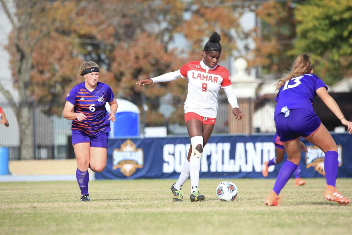 Lamar forward Esther Okoronkwo works her way through two Demon defenders during the Southland Conference Championship game on Sunday in Conway, Arkansas. Lamar won the game over Northwestern State, 3-1.