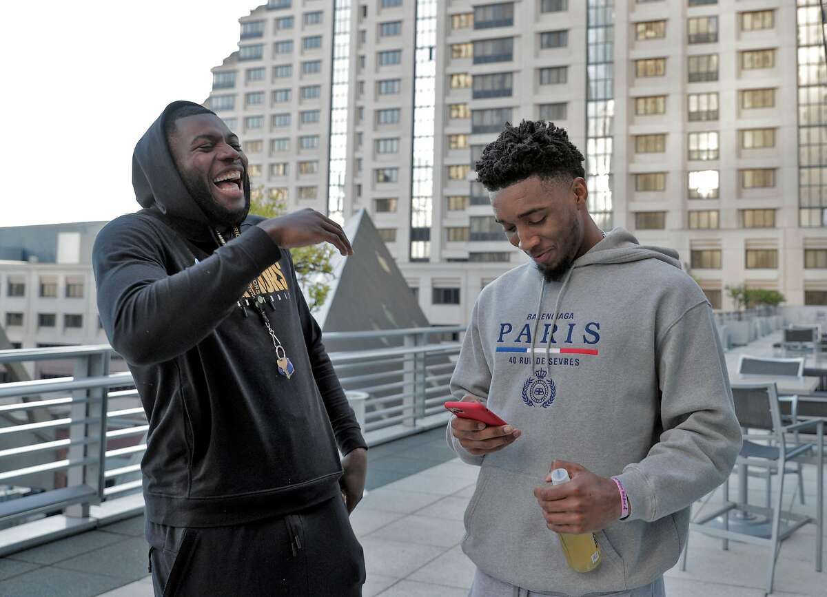 Warriors rookie Eric Paschall, left, laughs with his childhood friend Donovan Mitchell, right, of the Utah Jazz, as they make dinner plans at the Four Seasons Hotel in San Francisco, Calif., on Sunday, November 10, 2019. Two friends met the evening before the two teams played at Chase Center to have dinner and catch up.