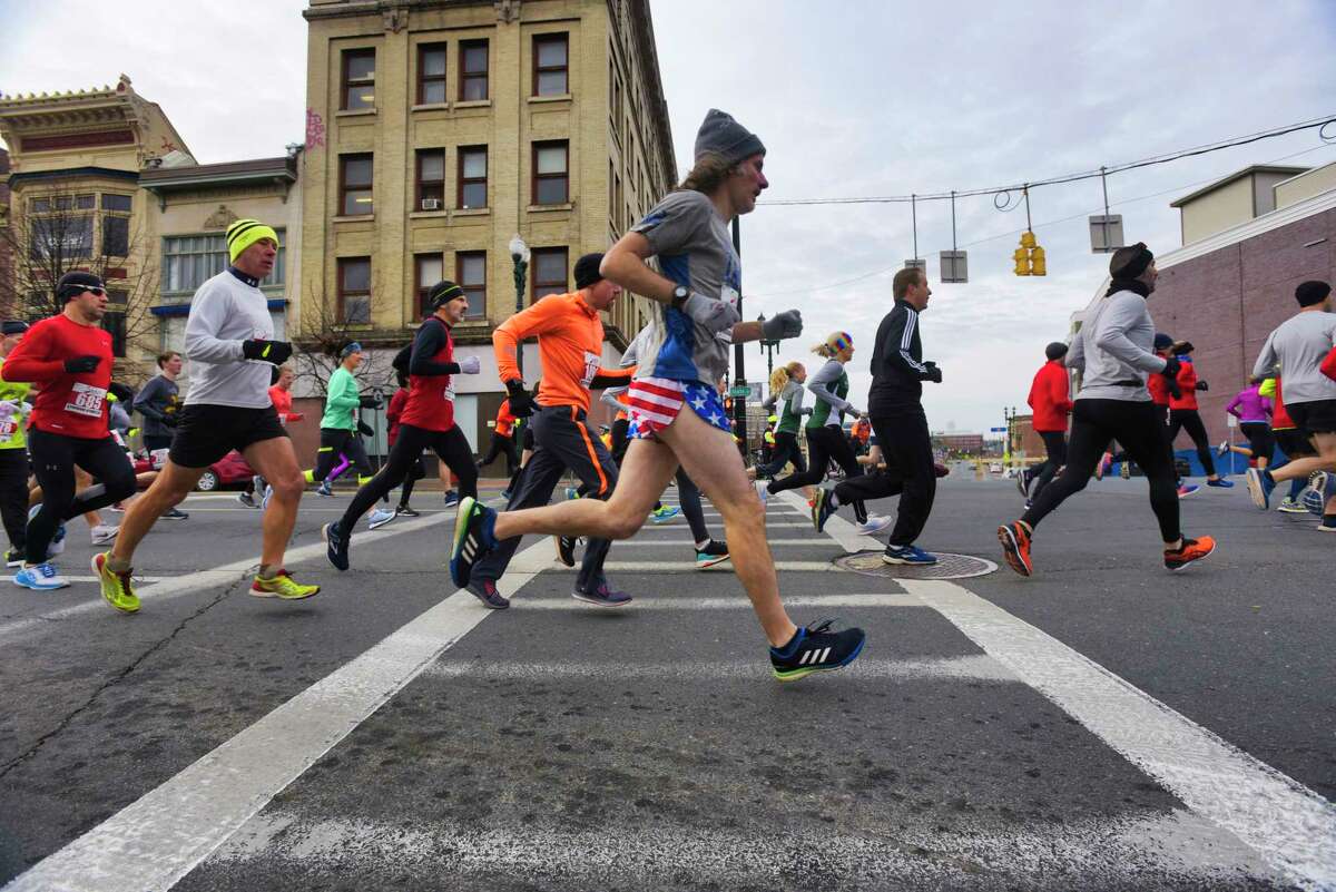 Runners make their way along State Street during the start of the Stockade-athon on Sunday, Nov. 10, 2019, in Schenectady, N.Y. (Paul Buckowski/Times Union)