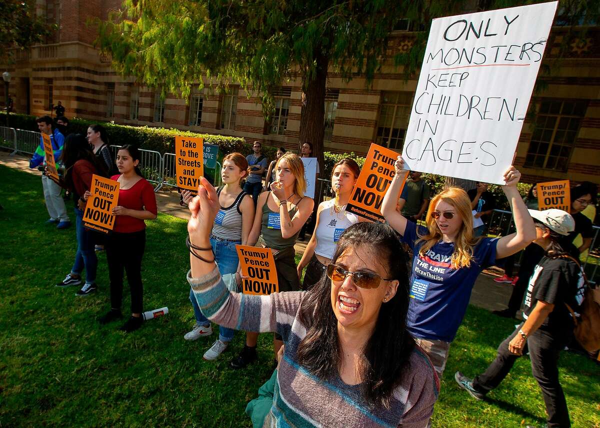 Francisca Vergara, right, chants during demonstration outside UCLA's Moore Hall, where Donald Trump Jr. was expected to speak while on tour for his new book "Triggered," in Los Angeles, Calif. on Sunday, Nov. 10, 2019. (Brian van der Brug/Los Angeles Times/TNS)